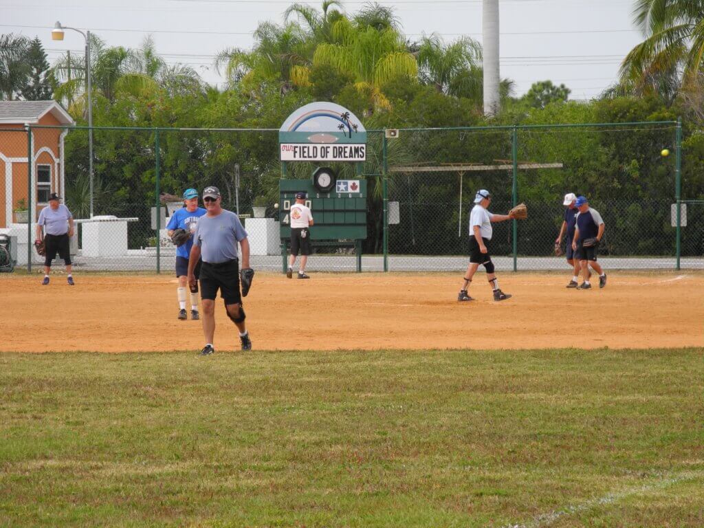 Bonita Terra residents play softball at the grass fenced field.
