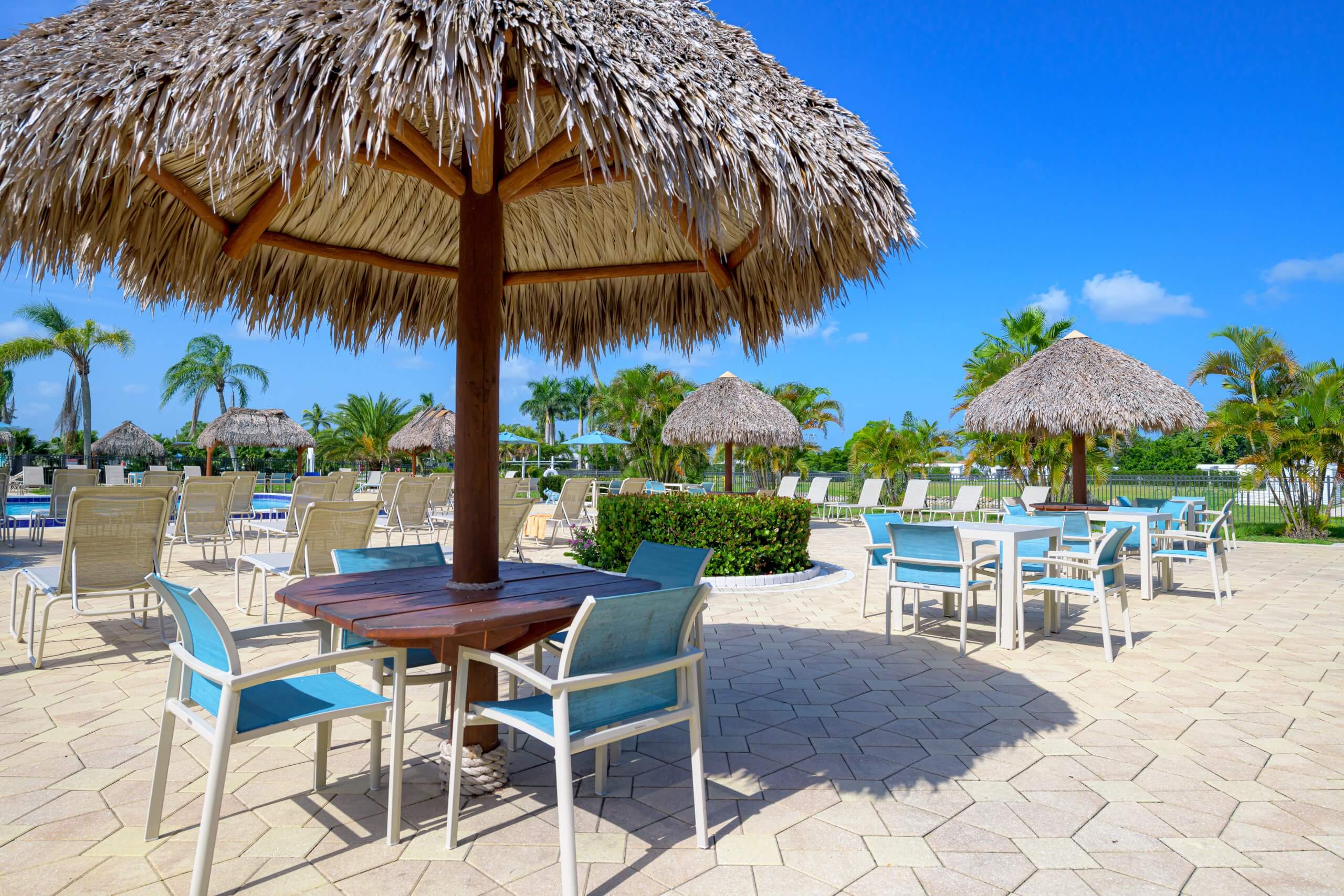 Outdoor patio area next to the swimming pool